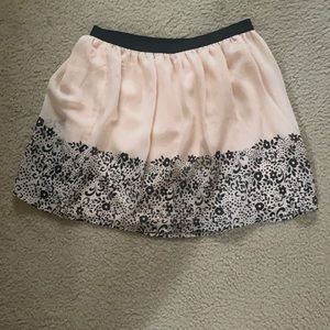 Pink and black floral mini skirt